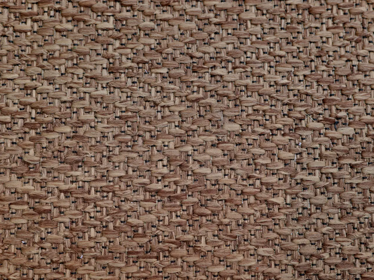 Woven brown furnishing fabric with a pronounced textured surface